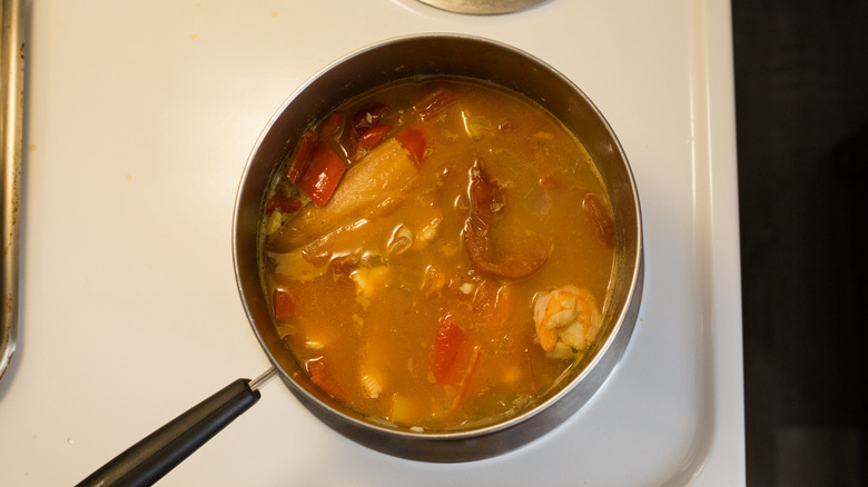 fish soup cooking in pot