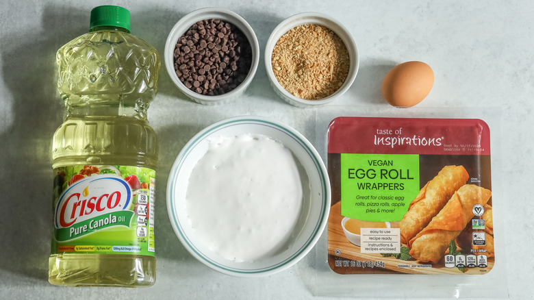 egg roll wrappers with marshmallow fluff, crumbs, and chocolate chips