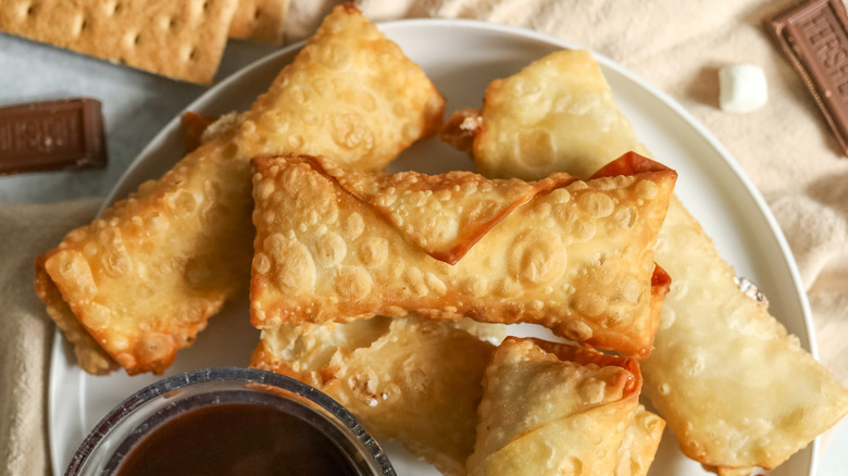 egg rolls with bowl of chocolate sauce