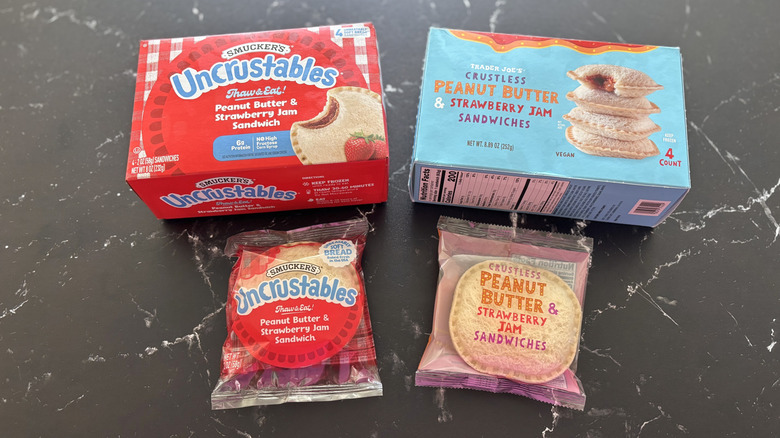 Uncrustables box and Trader Joe's crustless peanut butter and jelly sandwich box next to wrapped sandwiches