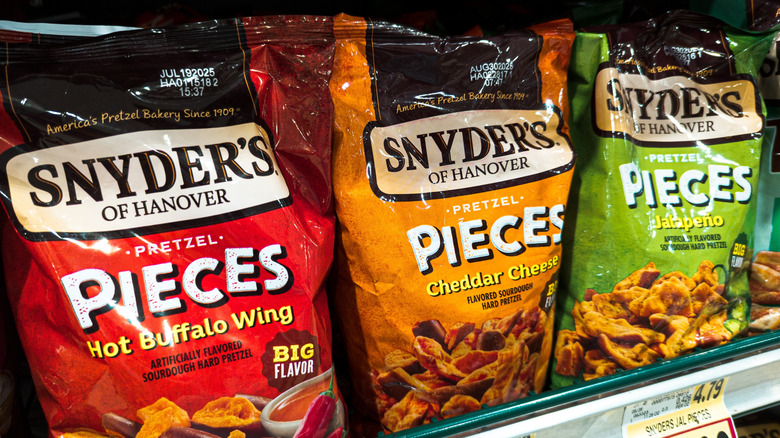 Bags of Snyder's of Hanover pretzels on a store shelf