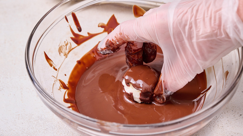 dipping banana in chocolate
