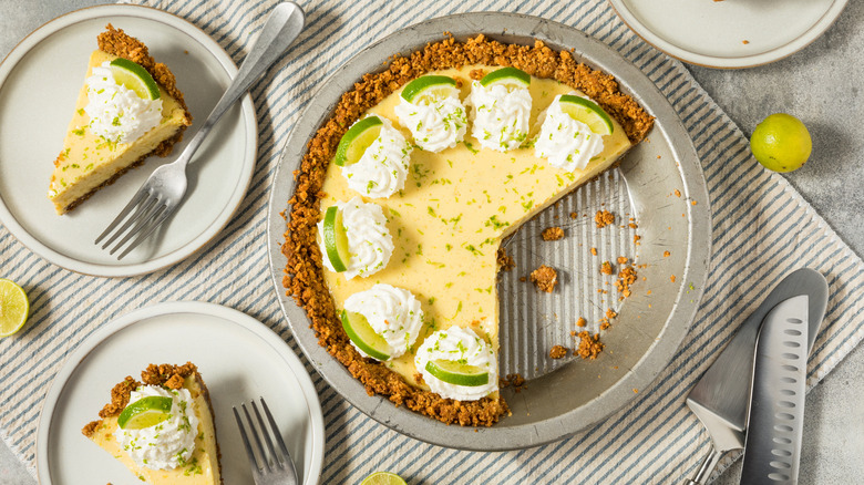 Key lime pie and slices with graham cracker crust