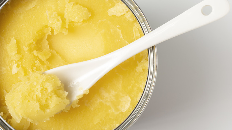 canned butter with spoon