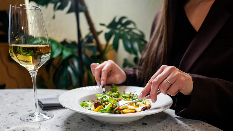 Person eating dinner at a table alone