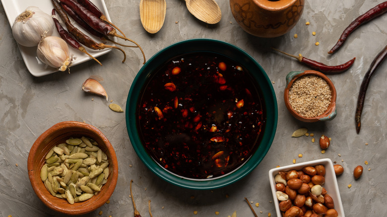 salsa macha with all the ingredients laid out on the table beside.