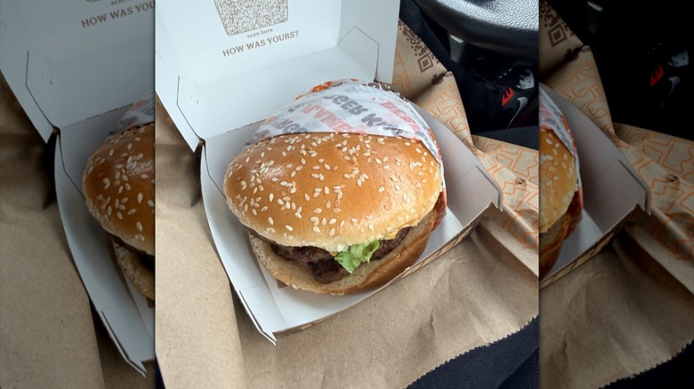Burger King's New Whopper is displayed in its cardboard carton.
