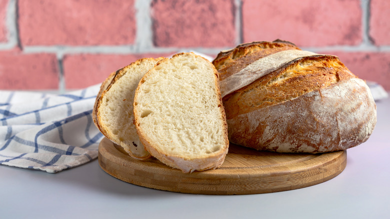 Sourdough loaf against a brick background