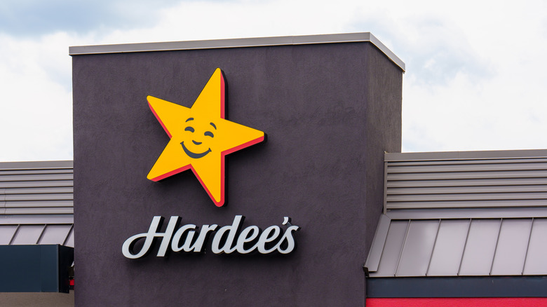 Hardee's smiling star sign on a restaurant.