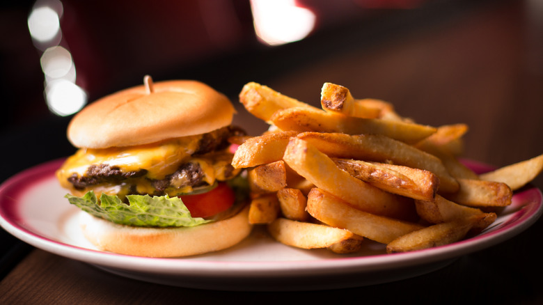 burger on plate with fries