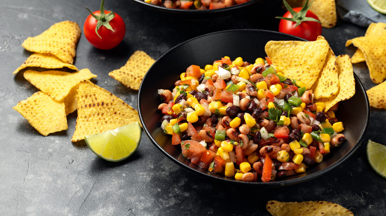 Bowl of cowboy caviar dip with tortilla chips