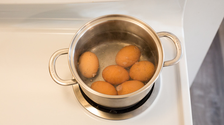eggs heating in stovetop pot