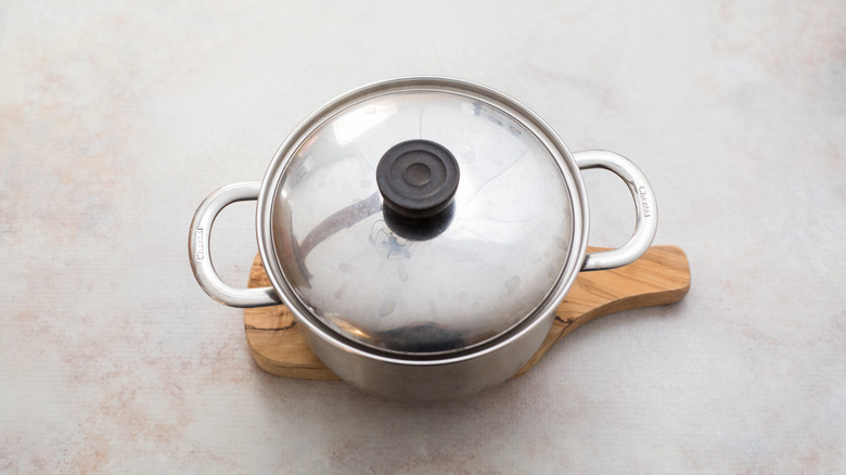 covered pot on marble table