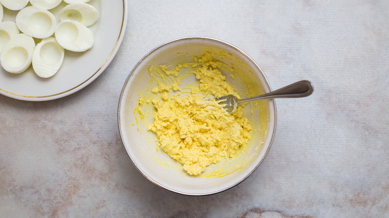 mashed egg yolks in bowl