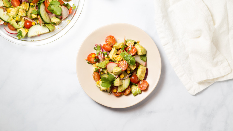 avocado salad served on table