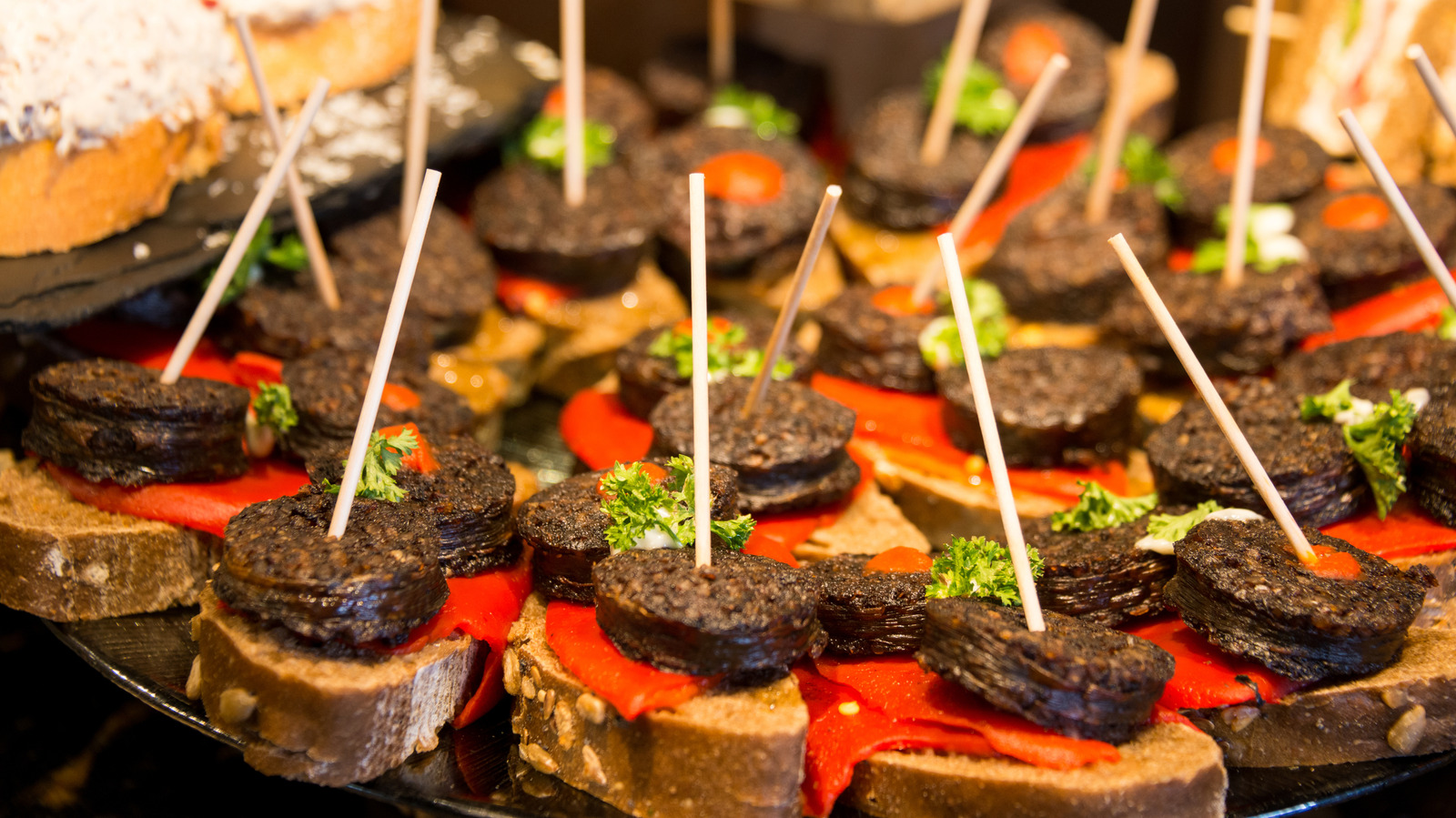 Spain's Version Of Bruschetta Is The Bite-Size Sandwich Snack Your Appetizer Table Needs - Tasting Table