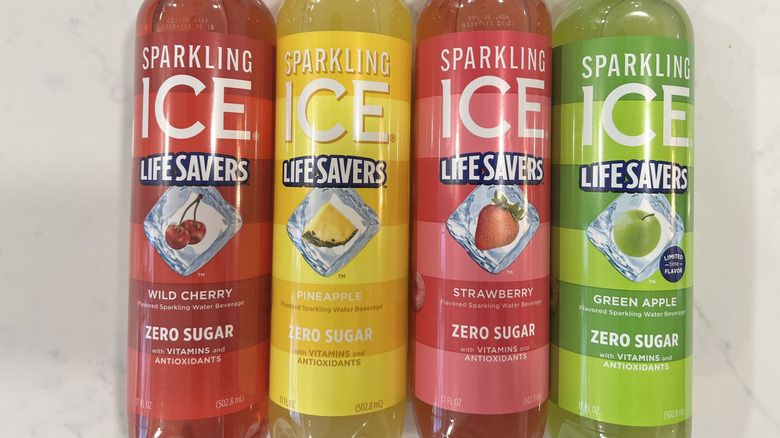 Four different Sparkling Ice Life Savers flavors in bottles