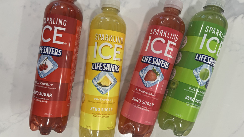 Four different Sparkling Ice Life Savers flavors in bottles
