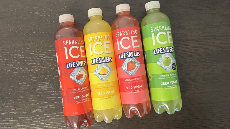 Four different Sparkling Ice Life Savers flavors in bottles.
