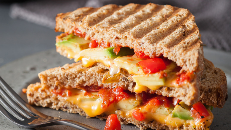 Grilled cheese sandwich with avocado and tomato