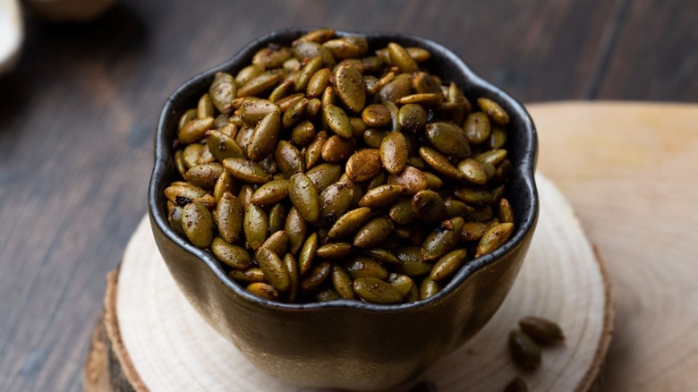 Bowl of chili-roasted pumpkin seeds