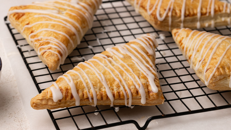 apple turnovers on wire rack 