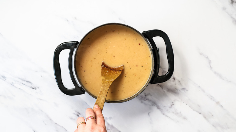 Stirring a fondue pot