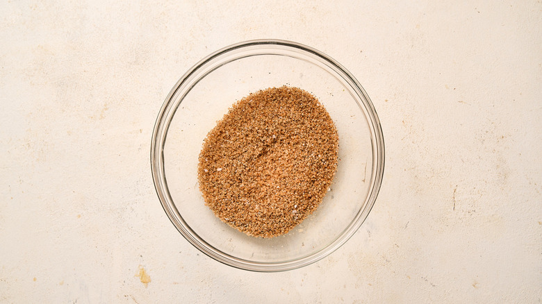 mixing dry rub ingredients in a bowl