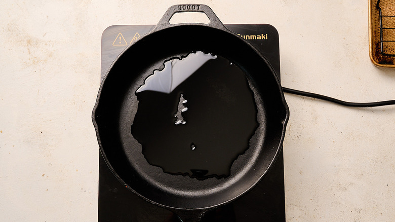 heating oil in a skillet