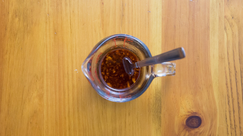 dressing in small measuring cup