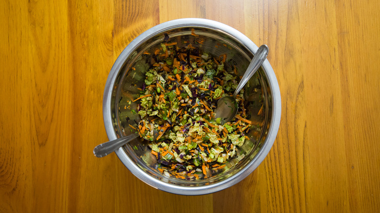 colorful coleslaw in mixing bowl