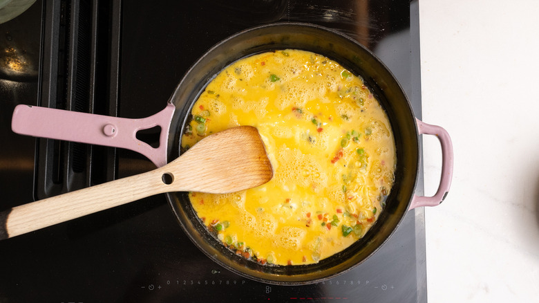 cooking omelette in pan
