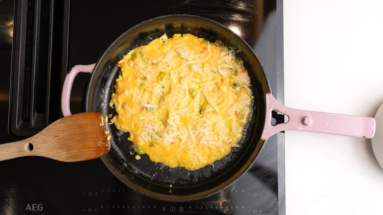 cheddar on omelette in pan