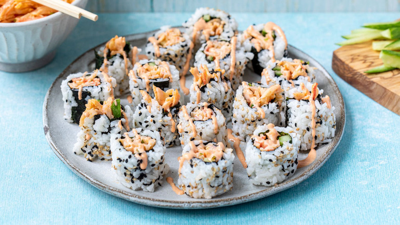 spicy sushi rolls on plate