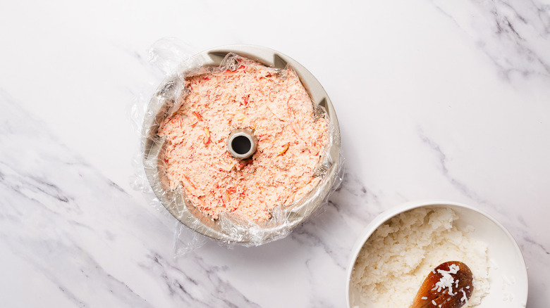 spicy crab in plastic wrapped bundt cake pan