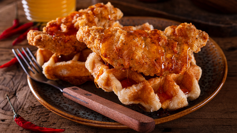 Chicken and waffles with spicy syrup and peppers