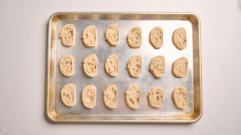 bread slices on a baking sheet