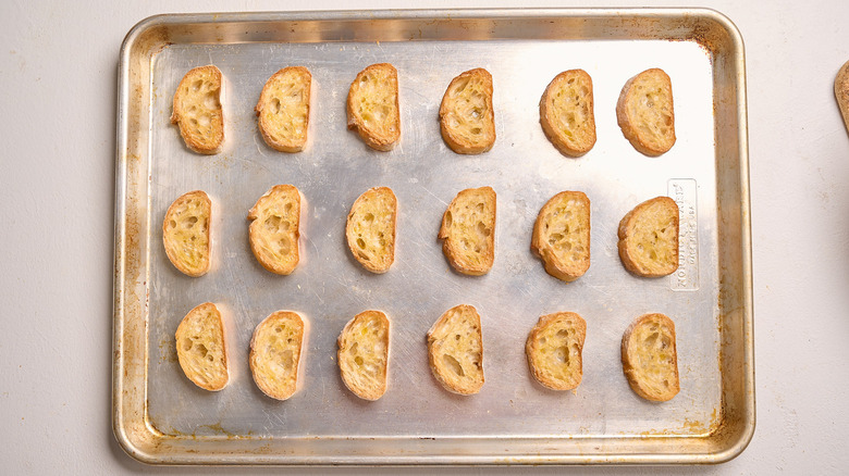 toasted crostini on a baking sheet