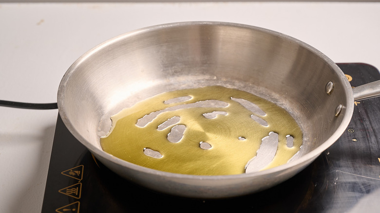 heating oil in a skillet
