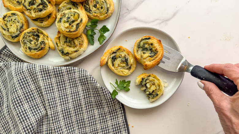 Spinach artichoke dip pinwheels on plate