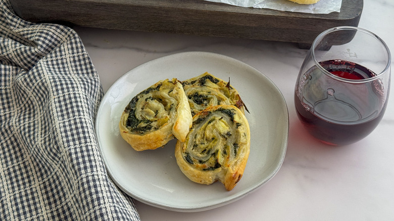 3 spinach artichoke pinwheels on plate