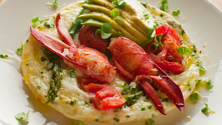 Omelet topped with lobster claws