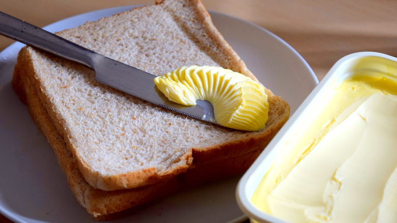 Butter spread on slice of bread