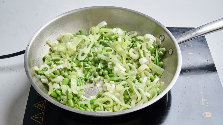 cooking vegetables in a skillet