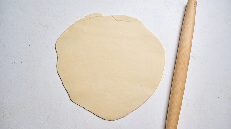 dough rolled out with a rolling pin