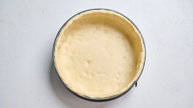 dough pressed into springform pan