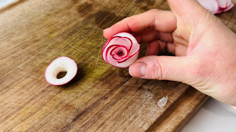 Hand holding radish rosette