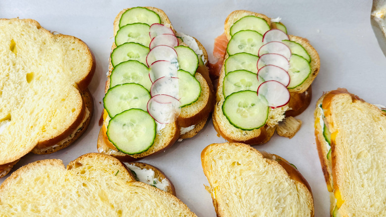 Cucumber and radish slices layered on sandwiches