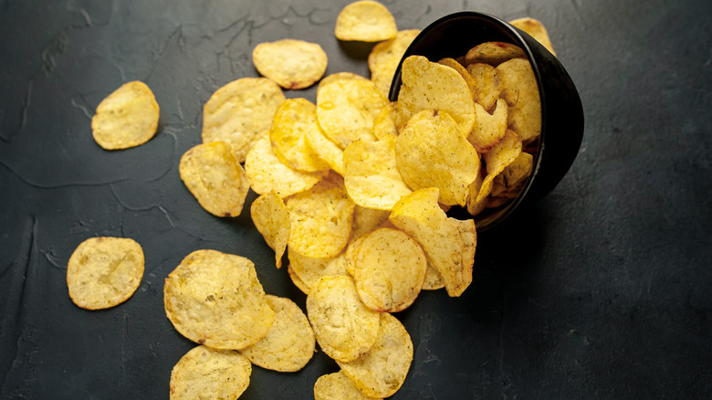 potato chips spilling from bowl