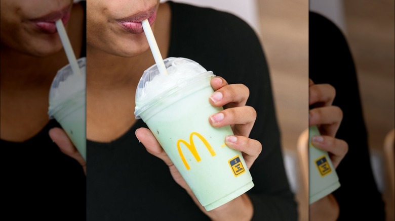Person drinking a McDonald's Shamrock Shake